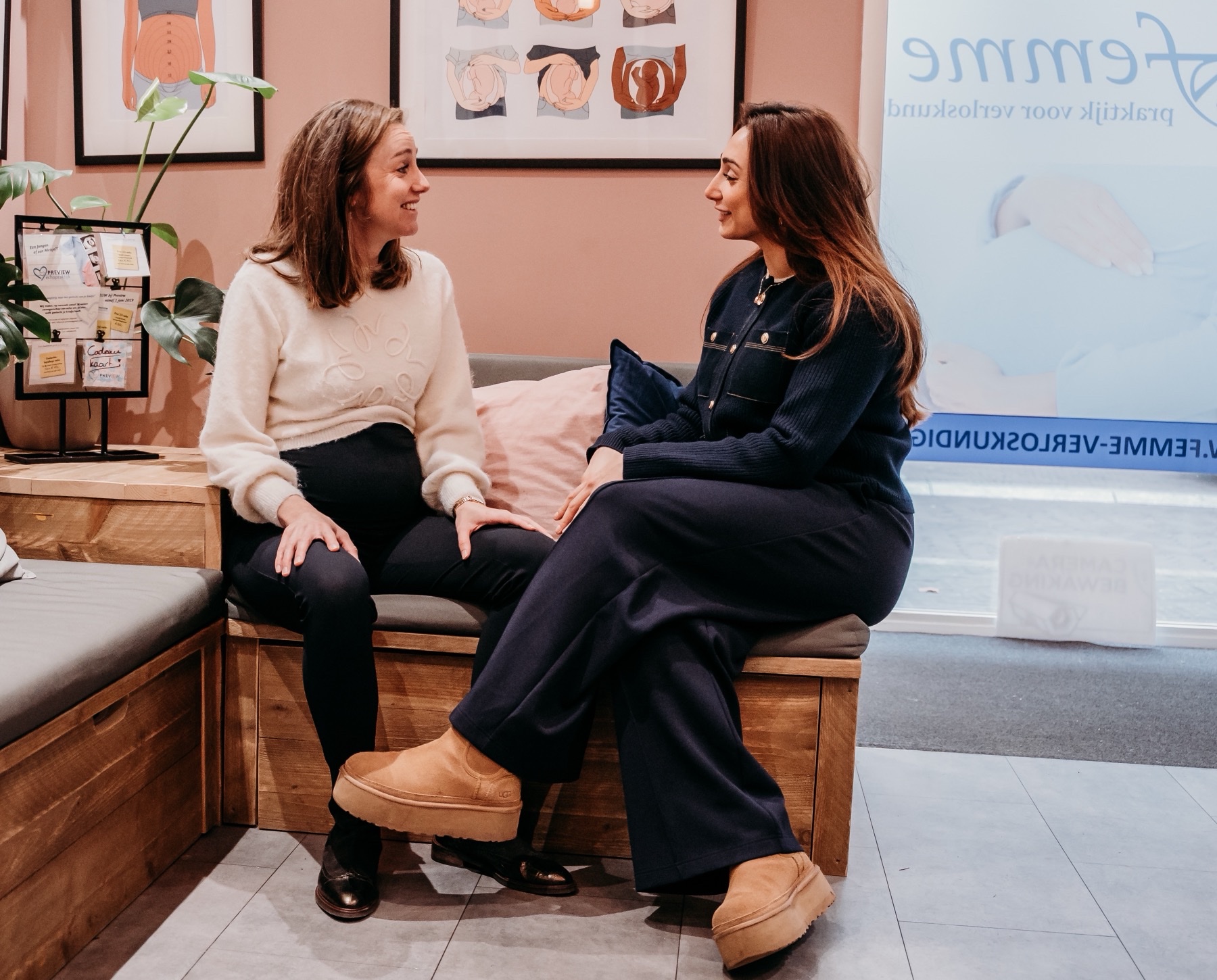 Two healthcare professionals from Femme in conversation in the practice